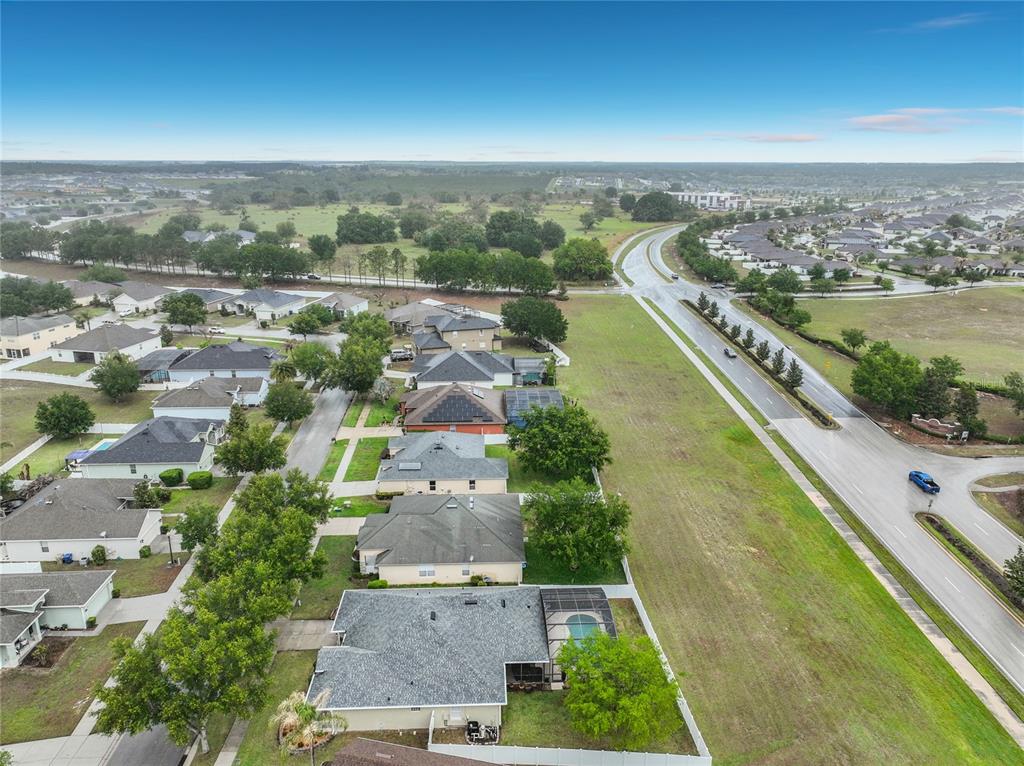 135 Blackstone Creek Road Groveland, FL 34736 - Photo 62 of 62 an aerial view of residential houses with outdoor space and ocean