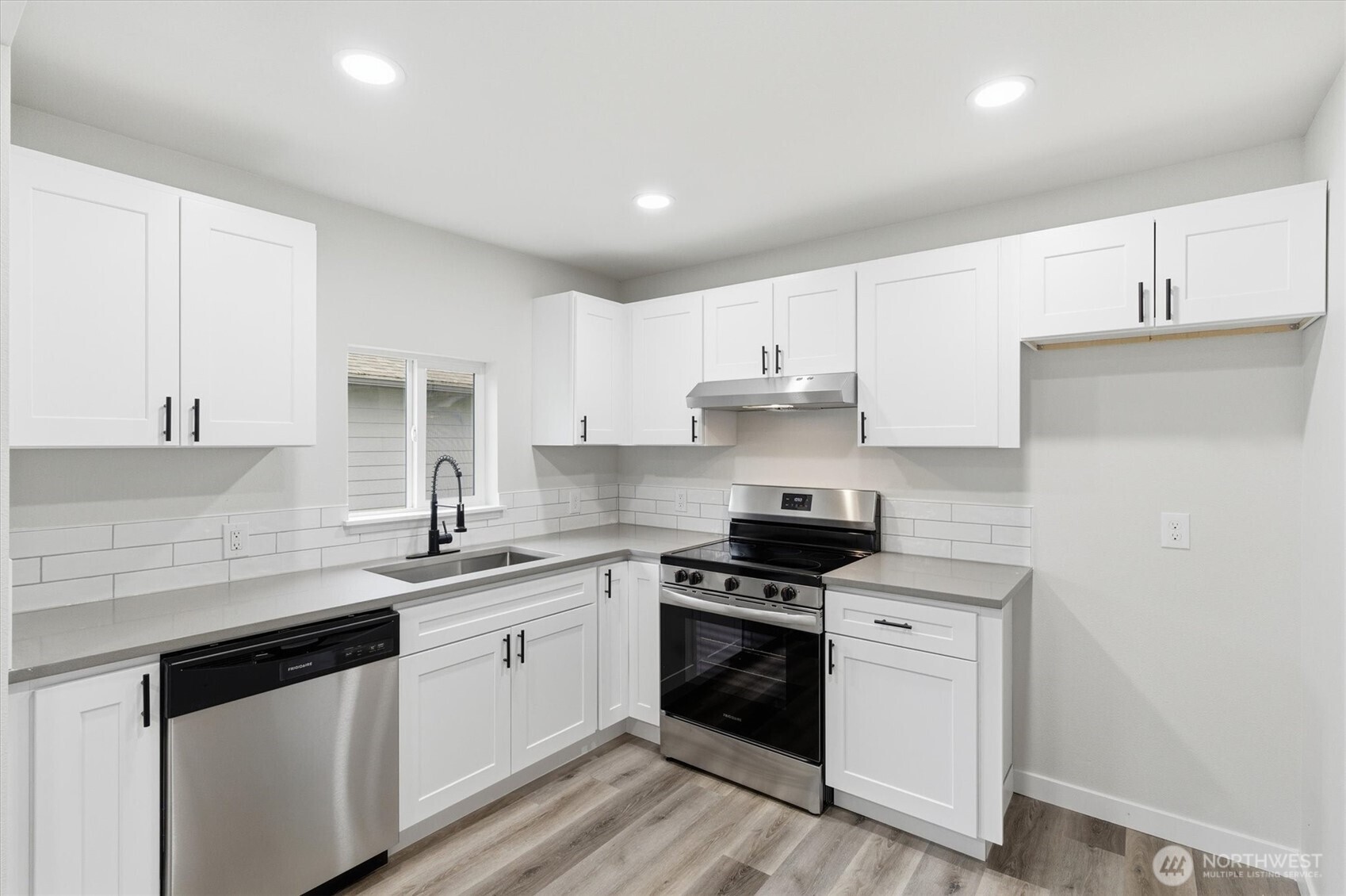 289 20th Avenue Longview, WA 98632 - Photo 12 of 38 a kitchen with stainless steel appliances granite countertop a sink stove and refrigerator