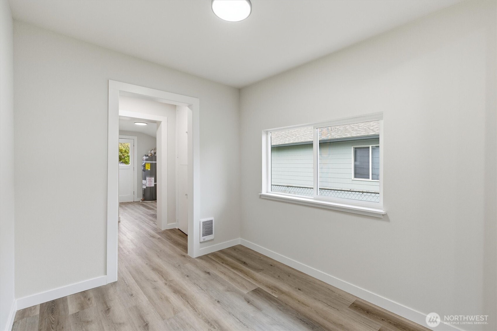 289 20th Avenue Longview, WA 98632 - Photo 14 of 38 an empty room with wooden floor and windows