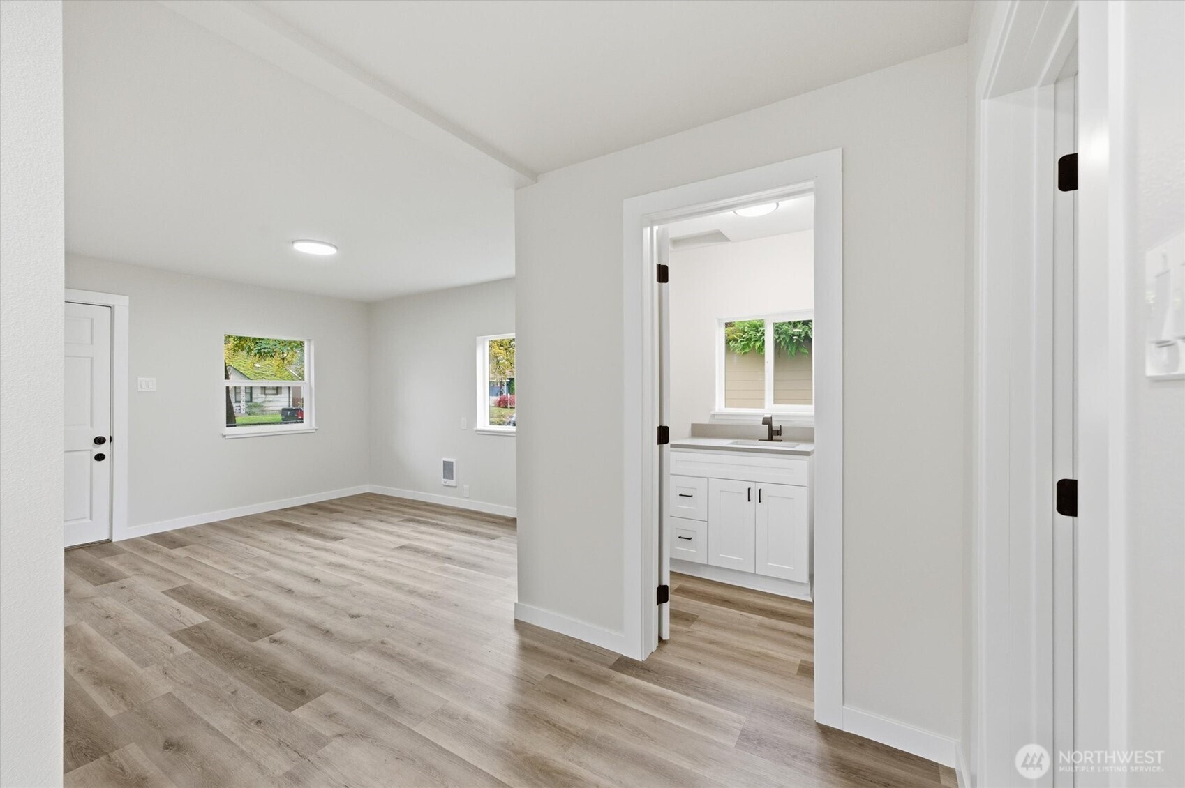 289 20th Avenue Longview, WA 98632 - Photo 8 of 38 a view of a kitchen with wooden floor and white doors