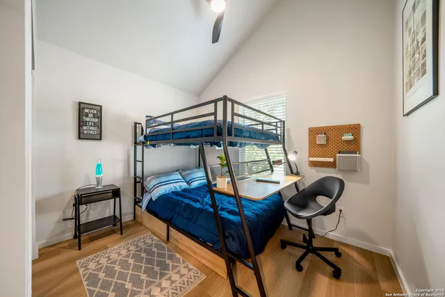 a bedroom with furniture and a window