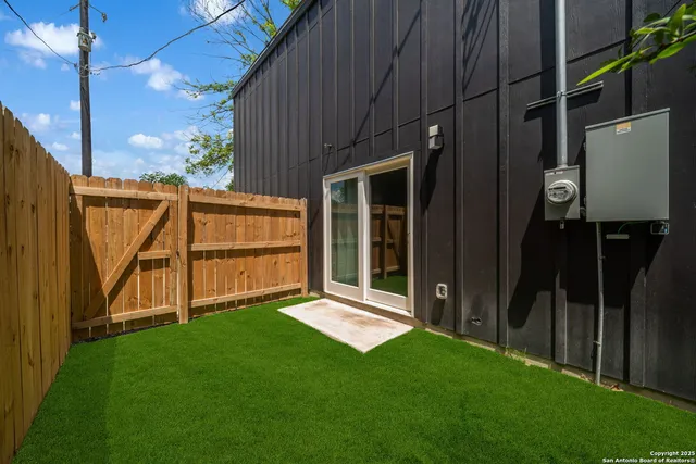 a view of backyard with flat screen tv and a large window