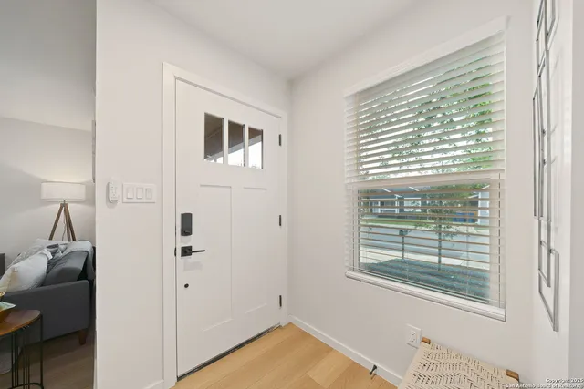 a view of livingroom with furniture and window