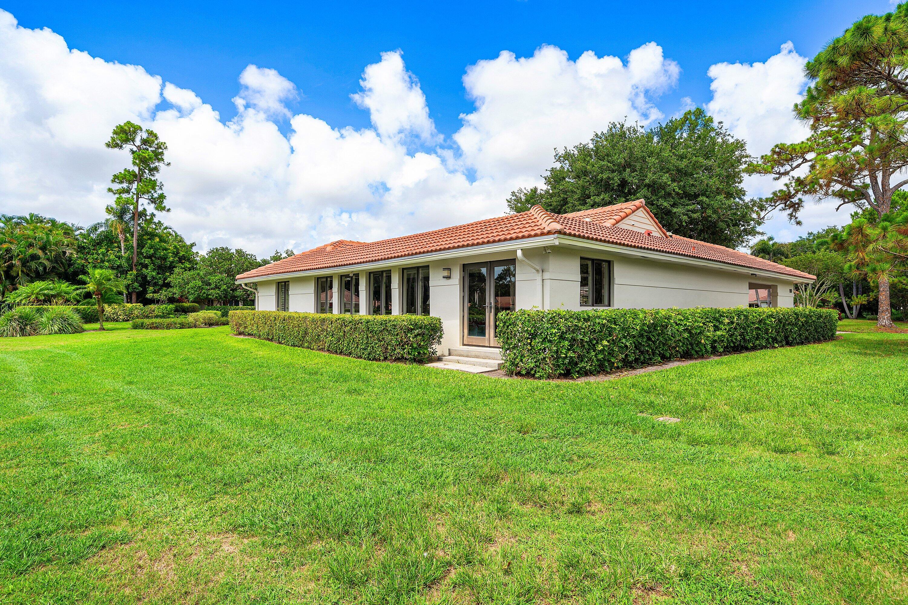 4365 Shell Drake Lane Boynton Beach, FL 33436 - Photo 29 of 56 a view of a house with a yard