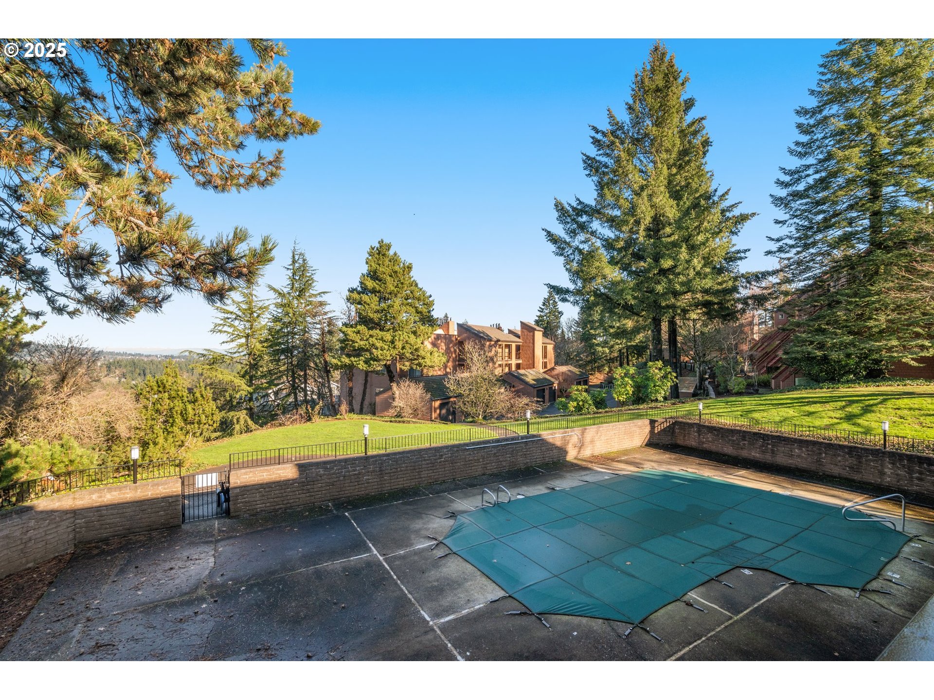 124 Oswego Summit Lake Oswego, OR 97035 - Photo 20 of 23 a view of a swimming pool with an outdoor space and seating area