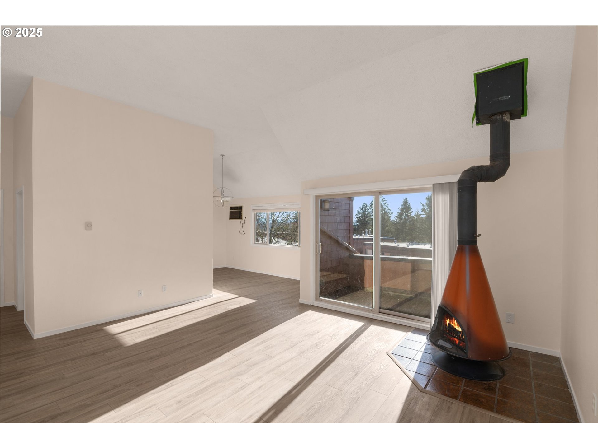 124 Oswego Summit Lake Oswego, OR 97035 - Photo 3 of 23 a view of empty room with wooden floor