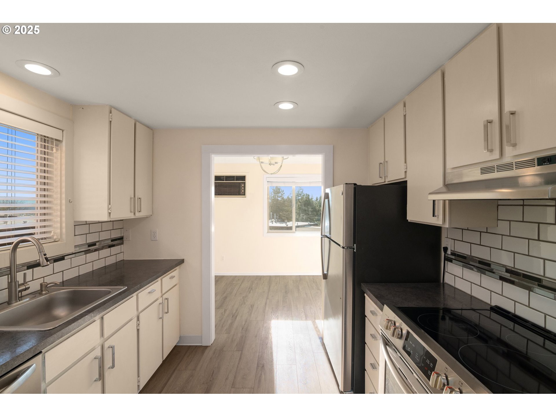 124 Oswego Summit Lake Oswego, OR 97035 - Photo 6 of 23 a kitchen with granite countertop a refrigerator and a sink