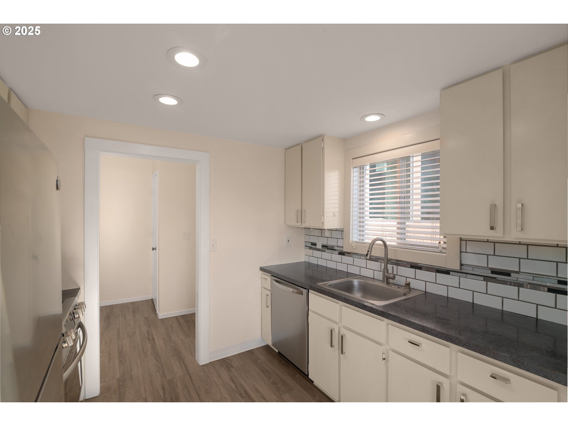 124 Oswego Summit Lake Oswego, OR 97035 - Photo 7 of 23 a kitchen with granite countertop a sink and a window