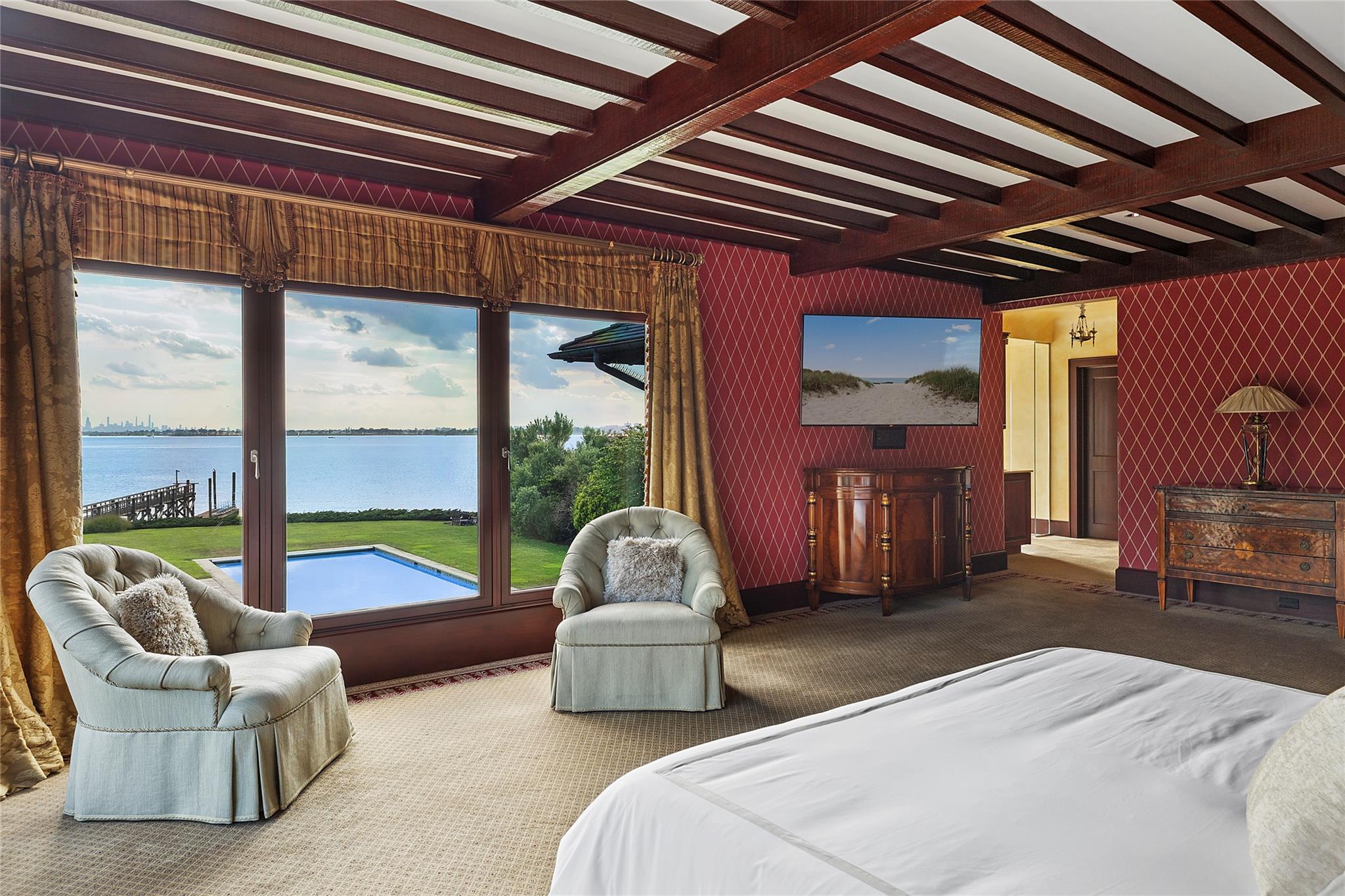 5 Half Moon Lane Sands Point, NY 11050 - Photo 14 of 35 a bedroom with furniture and large windows