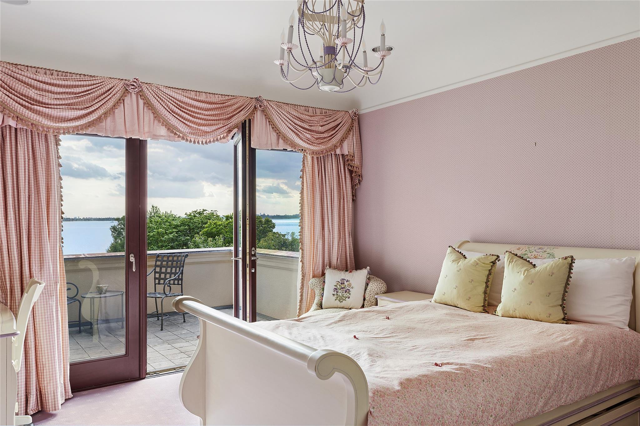 5 Half Moon Lane Sands Point, NY 11050 - Photo 18 of 35 a bedroom with a bed and a window