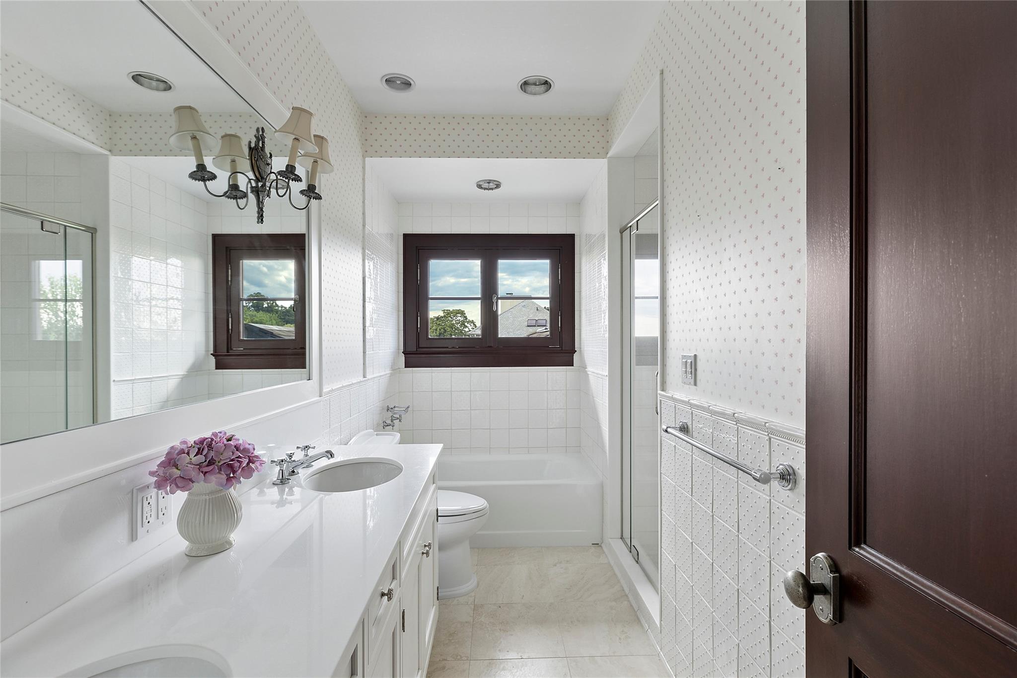 5 Half Moon Lane Sands Point, NY 11050 - Photo 20 of 35 a bathroom with a bathtub sink and mirror
