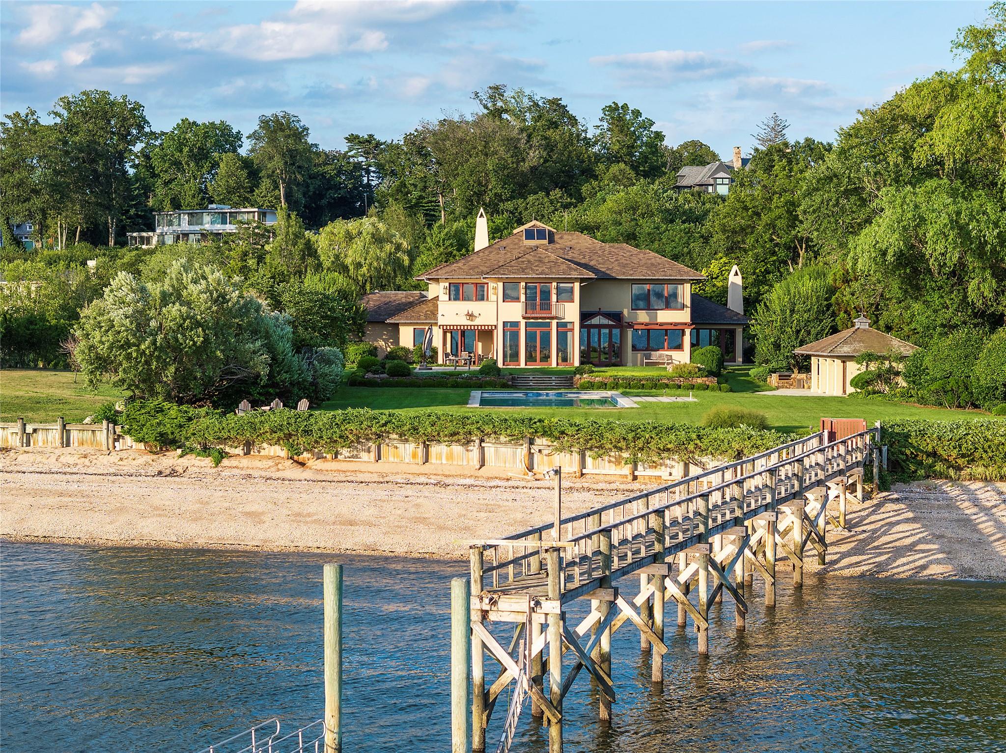 5 Half Moon Lane Sands Point, NY 11050 - Photo 26 of 35 a front view of a house with a yard