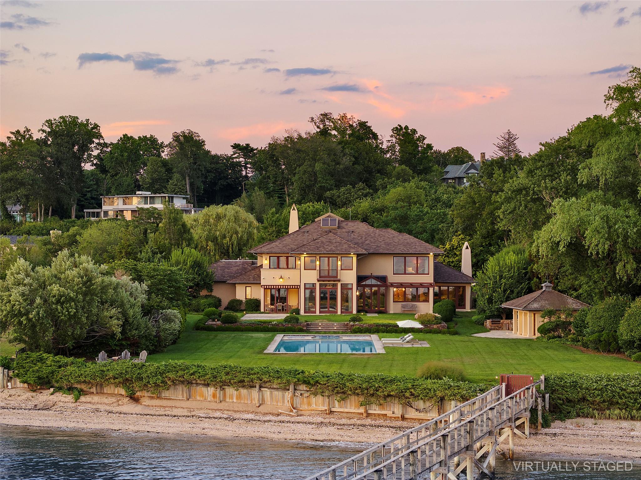 5 Half Moon Lane Sands Point, NY 11050 - Photo 28 of 35 a front view of a house with a yard