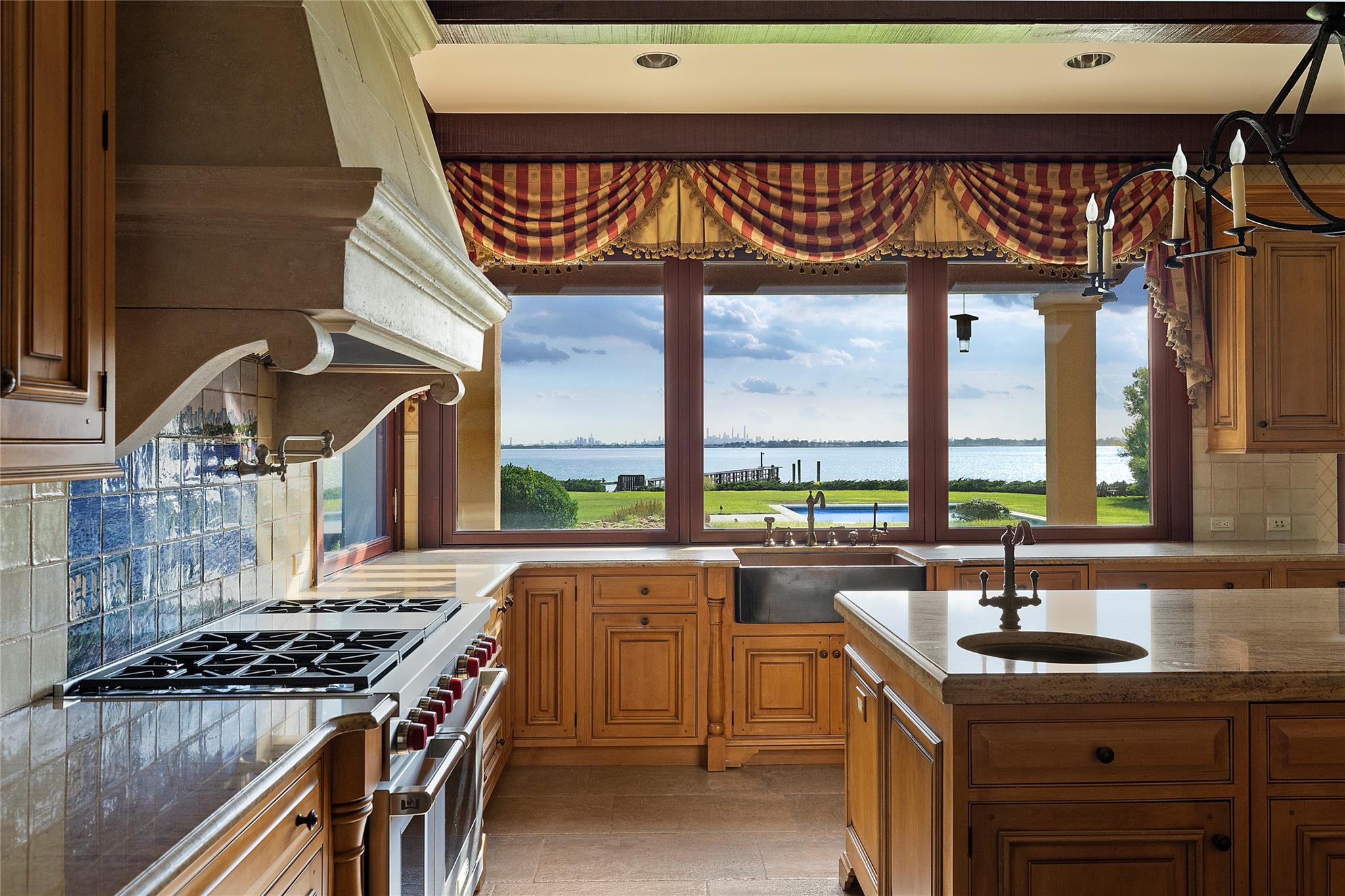 5 Half Moon Lane Sands Point, NY 11050 - Photo 8 of 35 a kitchen with a sink a stove and cabinets
