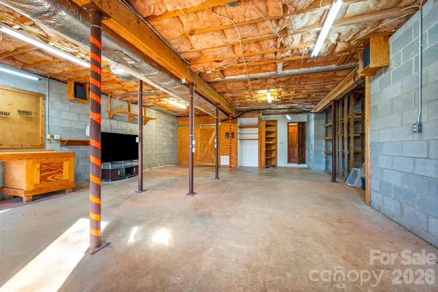 a view of a room with wooden walls