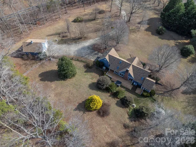 an aerial view of a house with swimming pool