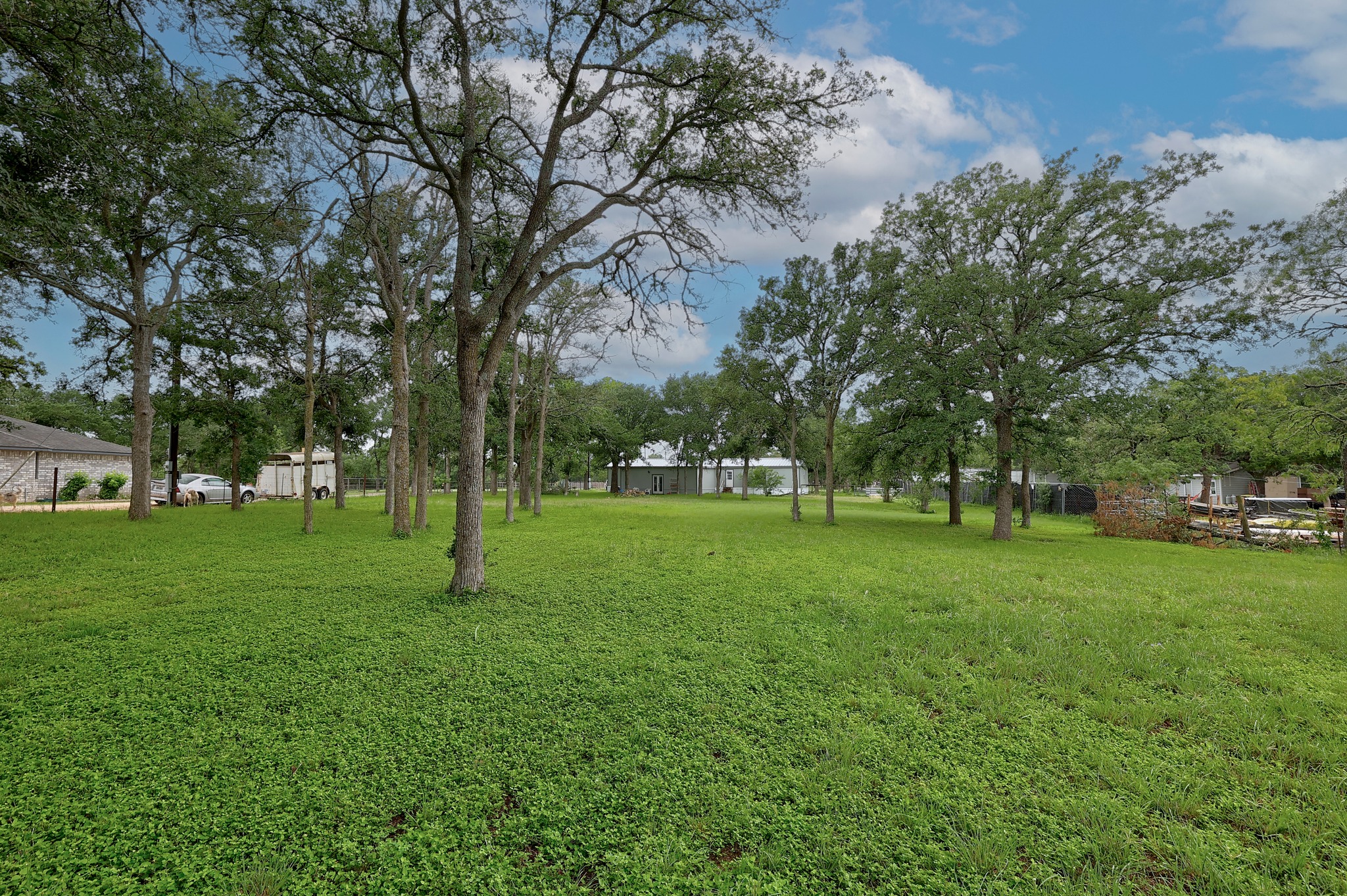 288 The Forest Road Dale, TX 78616 - Photo 26 of 31 a huge green field with lots of trees