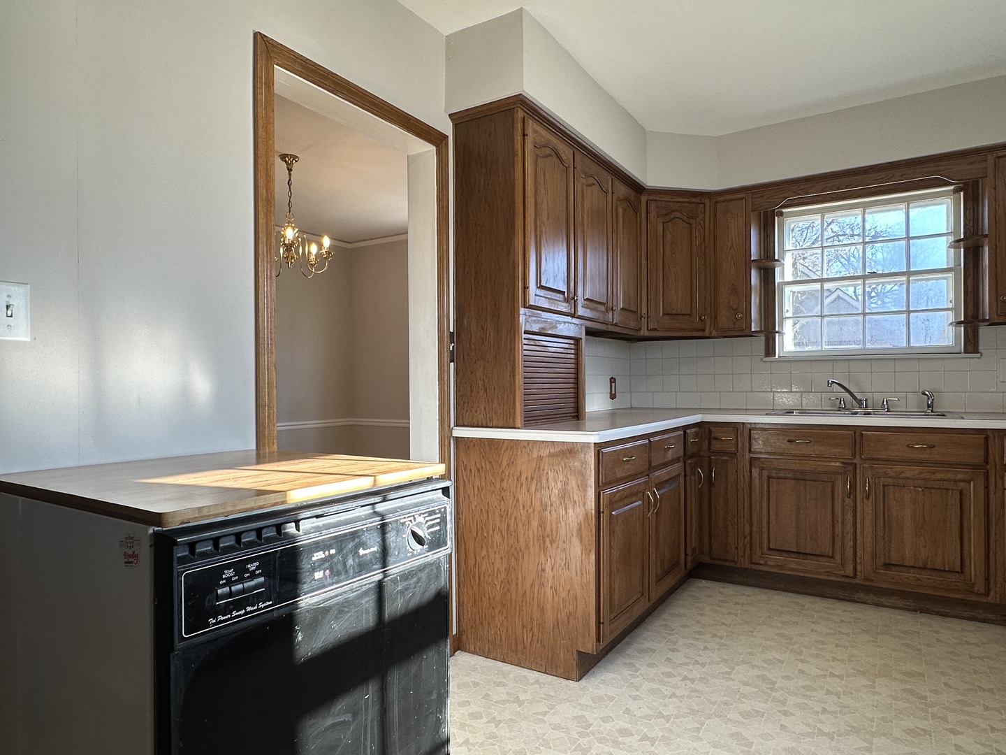 1195 South Myrtle Avenue Kankakee, IL 60901 - Photo 15 of 38 a kitchen with stainless steel appliances granite countertop a sink stove and cabinets