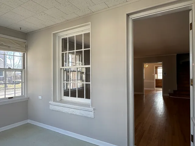 a view of empty room with windows and entryway