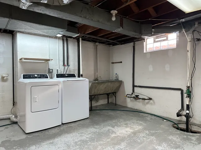 a view of storage and utility room with washer and dryer