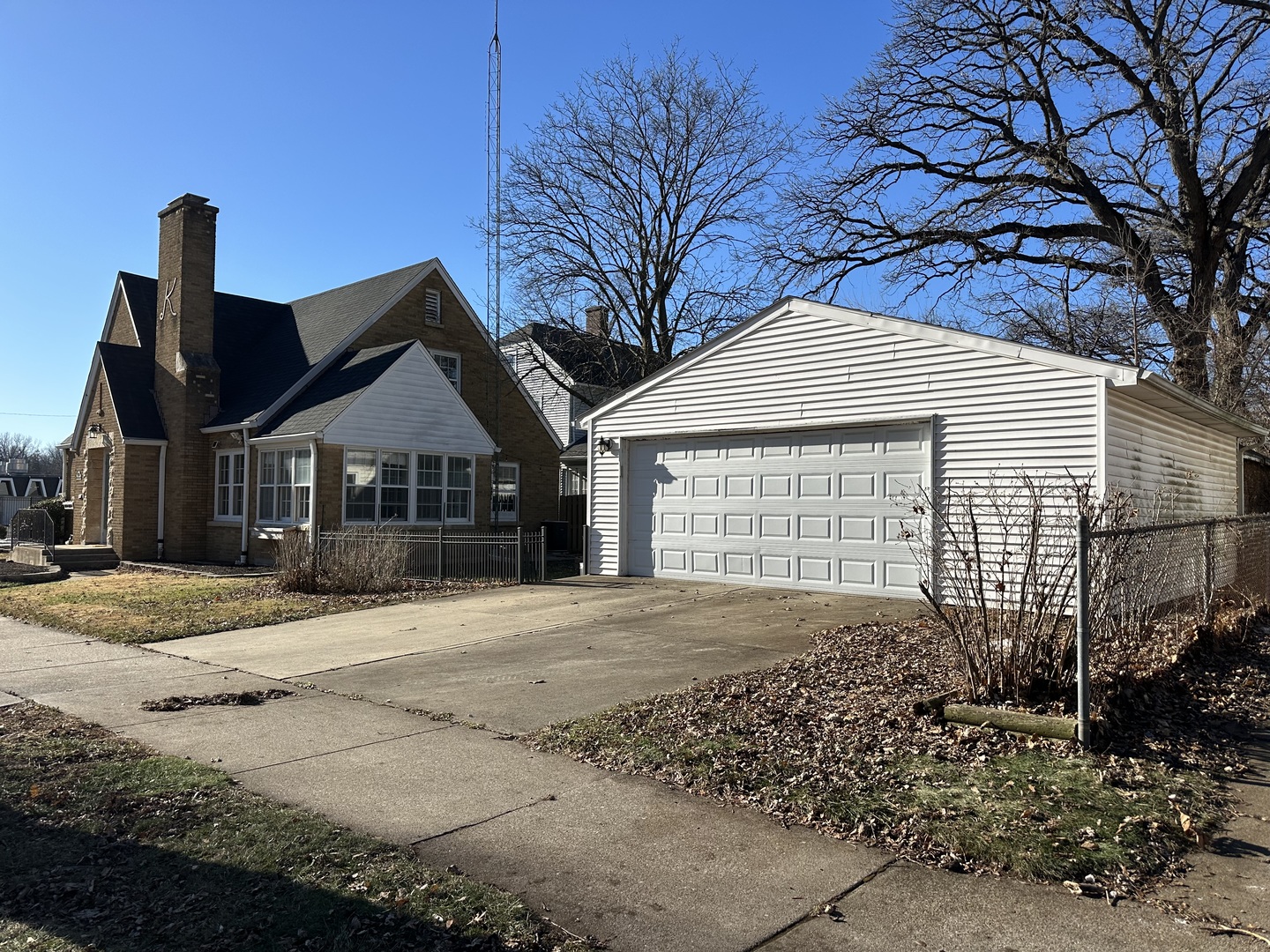 1195 South Myrtle Avenue Kankakee, IL 60901 - Photo 38 of 38 a front view of a house with a yard and garage