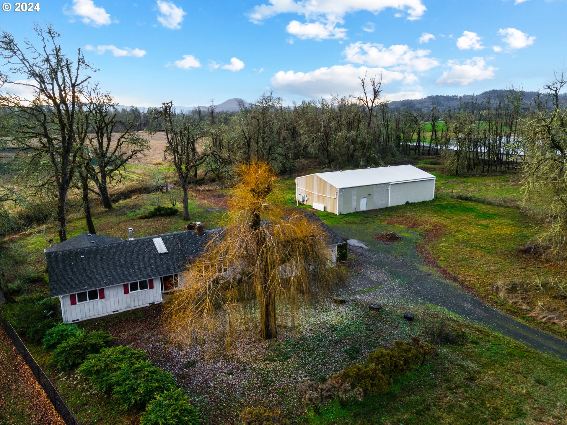 83766 Cloverdale Road Creswell, OR 97426 - Photo 40 of 45 a view of a house with a yard