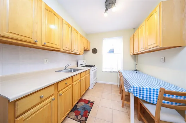 a kitchen with stainless steel appliances a sink and cabinets