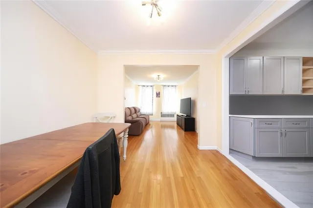 a view of a large kitchen with wooden floor and a sink