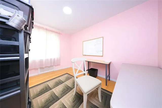 a bedroom with furniture and a window