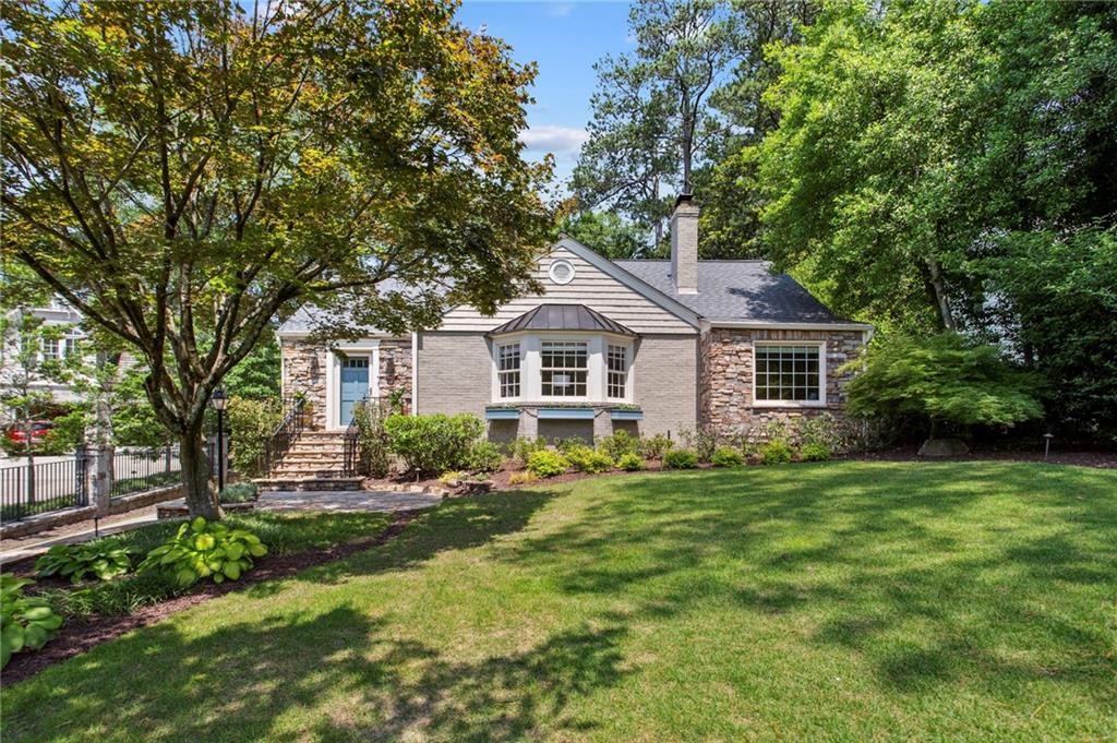 656 Darlington Road Northeast Atlanta, GA 30305 - Photo 1 of 1 a front view of a house with a yard