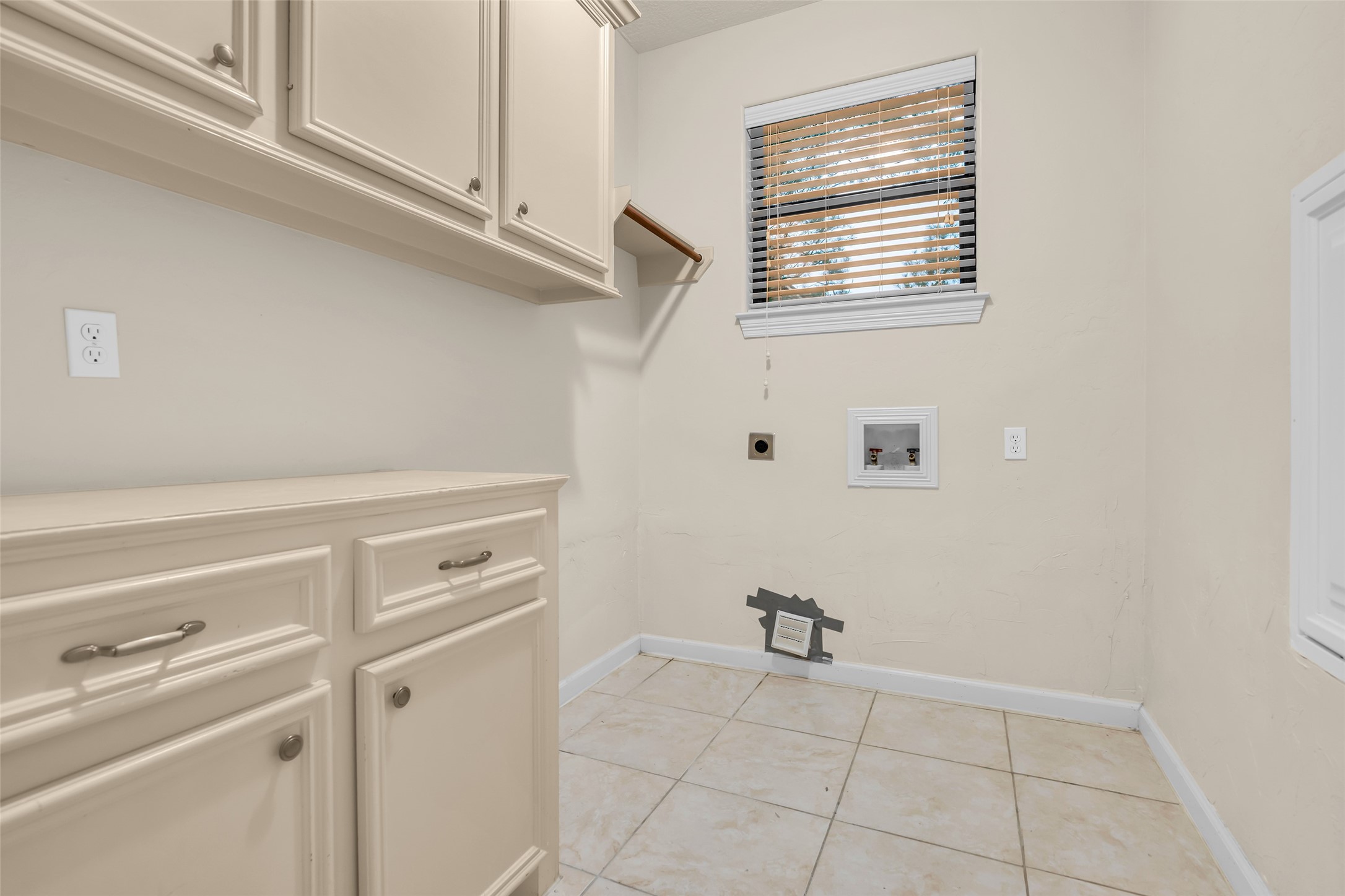1898 Longmire Road, Unit 5 Conroe, TX 77304 - Photo 29 of 48 a view of a storage and utility room with washer and dryer