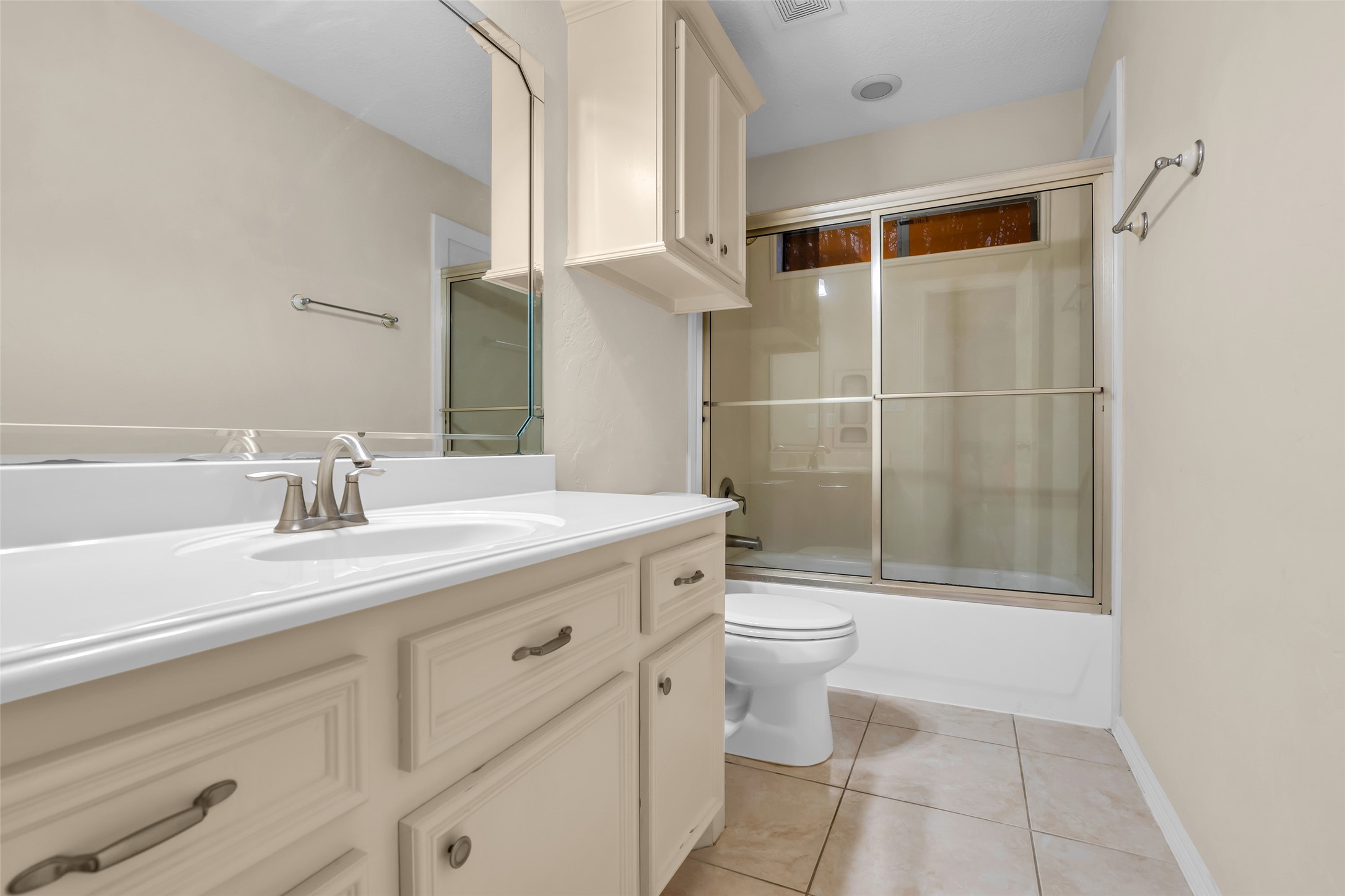 1898 Longmire Road, Unit 5 Conroe, TX 77304 - Photo 39 of 48 a bathroom with a sink a toilet and shower