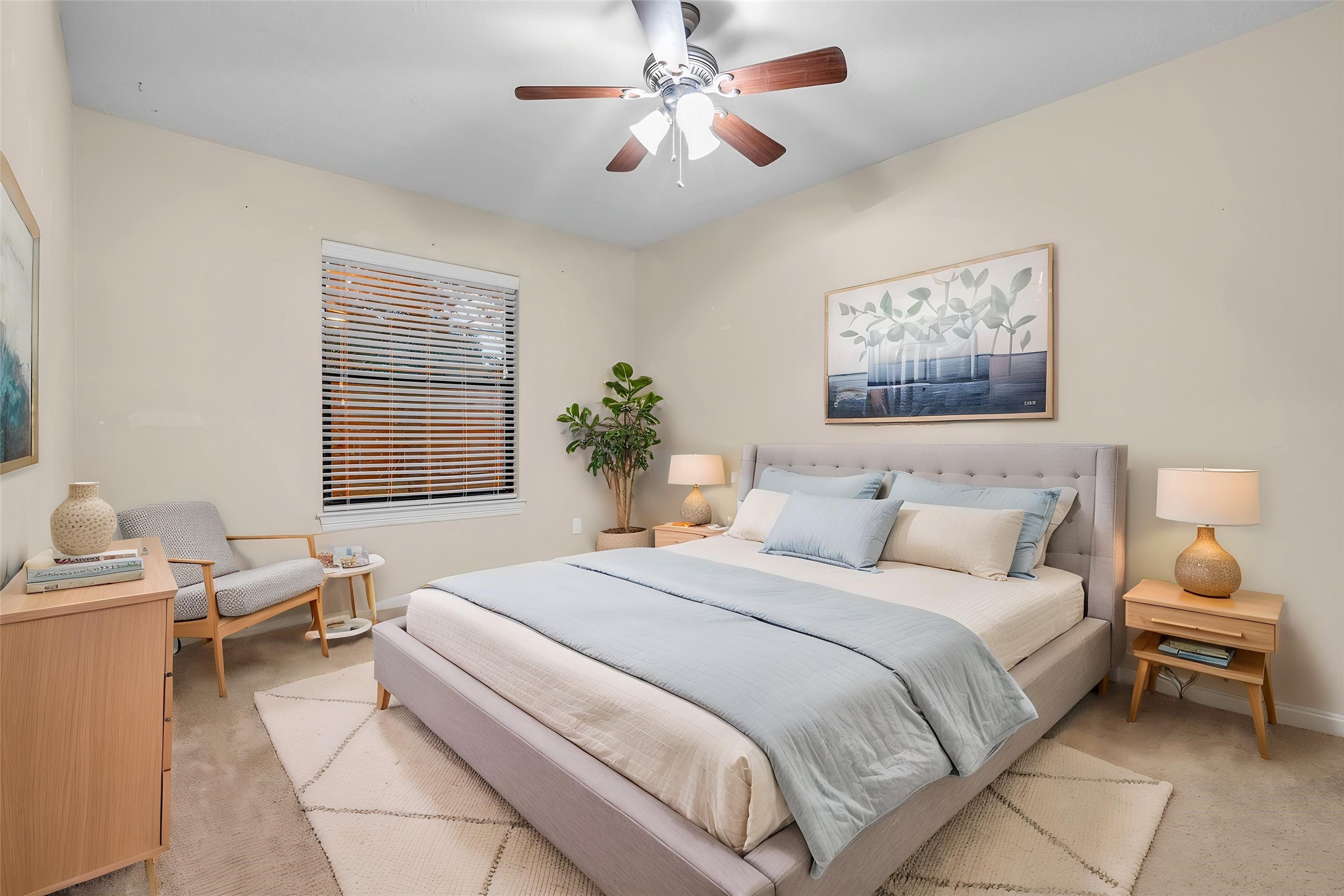 1898 Longmire Road, Unit 5 Conroe, TX 77304 - Photo 40 of 48 Experience the inviting charm of this virtually staged bedroom, featuring a cozy bed, stylish decor, and warm lighting, perfect for your dream home retreat.