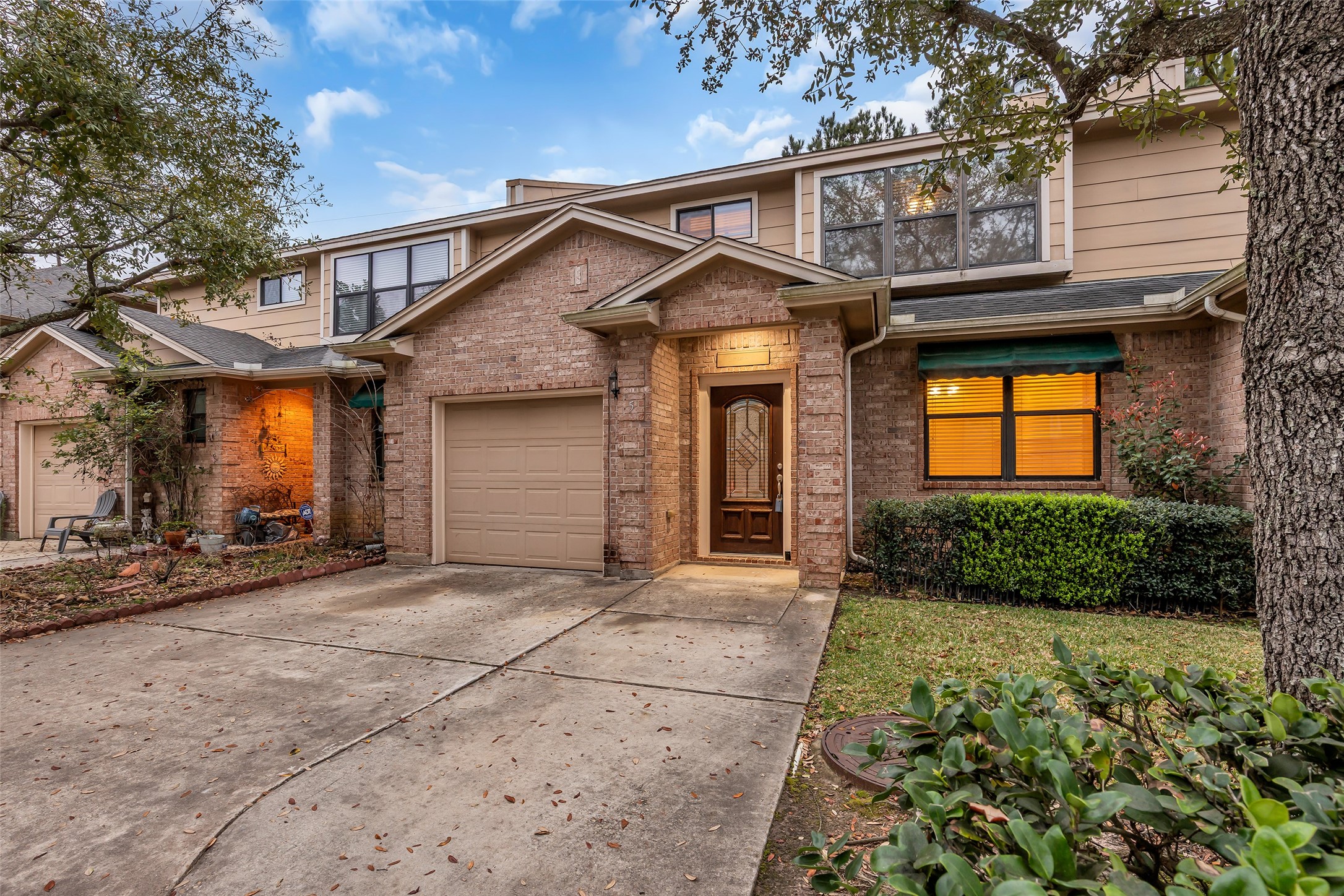 1898 Longmire Road, Unit 5 Conroe, TX 77304 - Photo 43 of 48 a view of a house with a patio