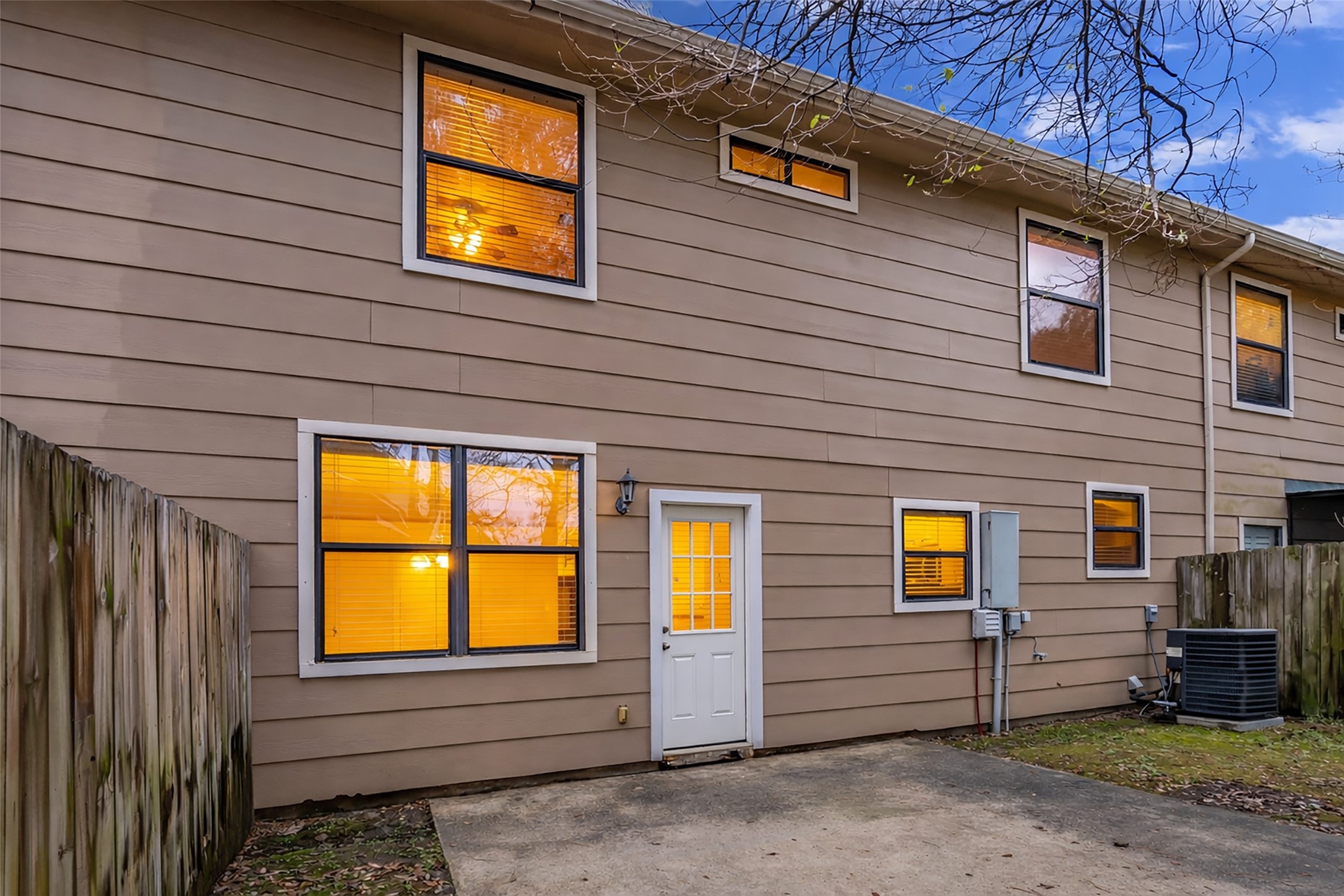 1898 Longmire Road, Unit 5 Conroe, TX 77304 - Photo 48 of 48 a view of a house with a backyard and a garage
