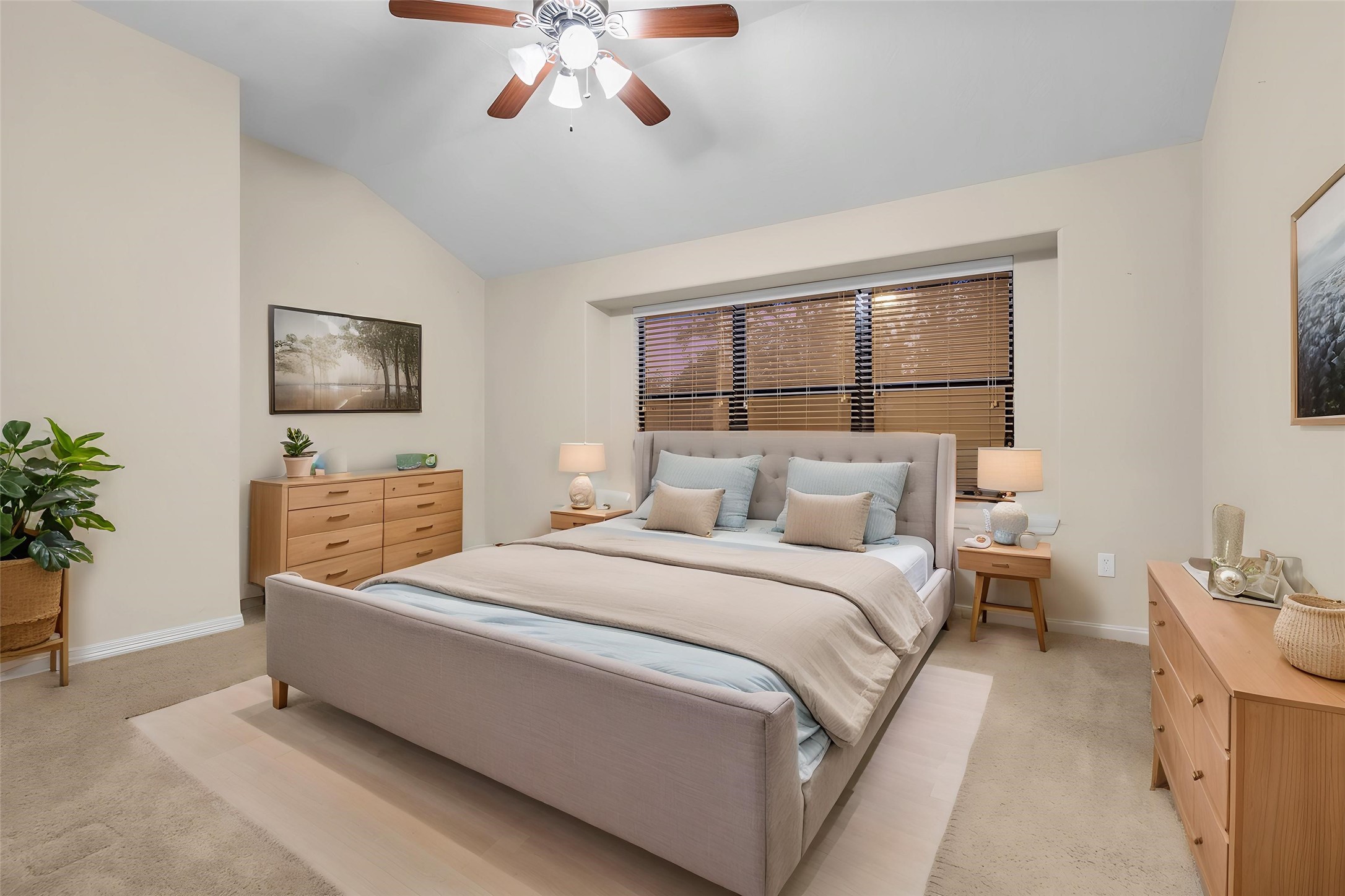 1898 Longmire Road, Unit 5 Conroe, TX 77304 - Photo 5 of 48 This virtually staged bedroom boasts a serene, modern ambiance with soft neutral tones, elegant furnishings, and abundant natural light, offering a perfect retreat for relaxation.