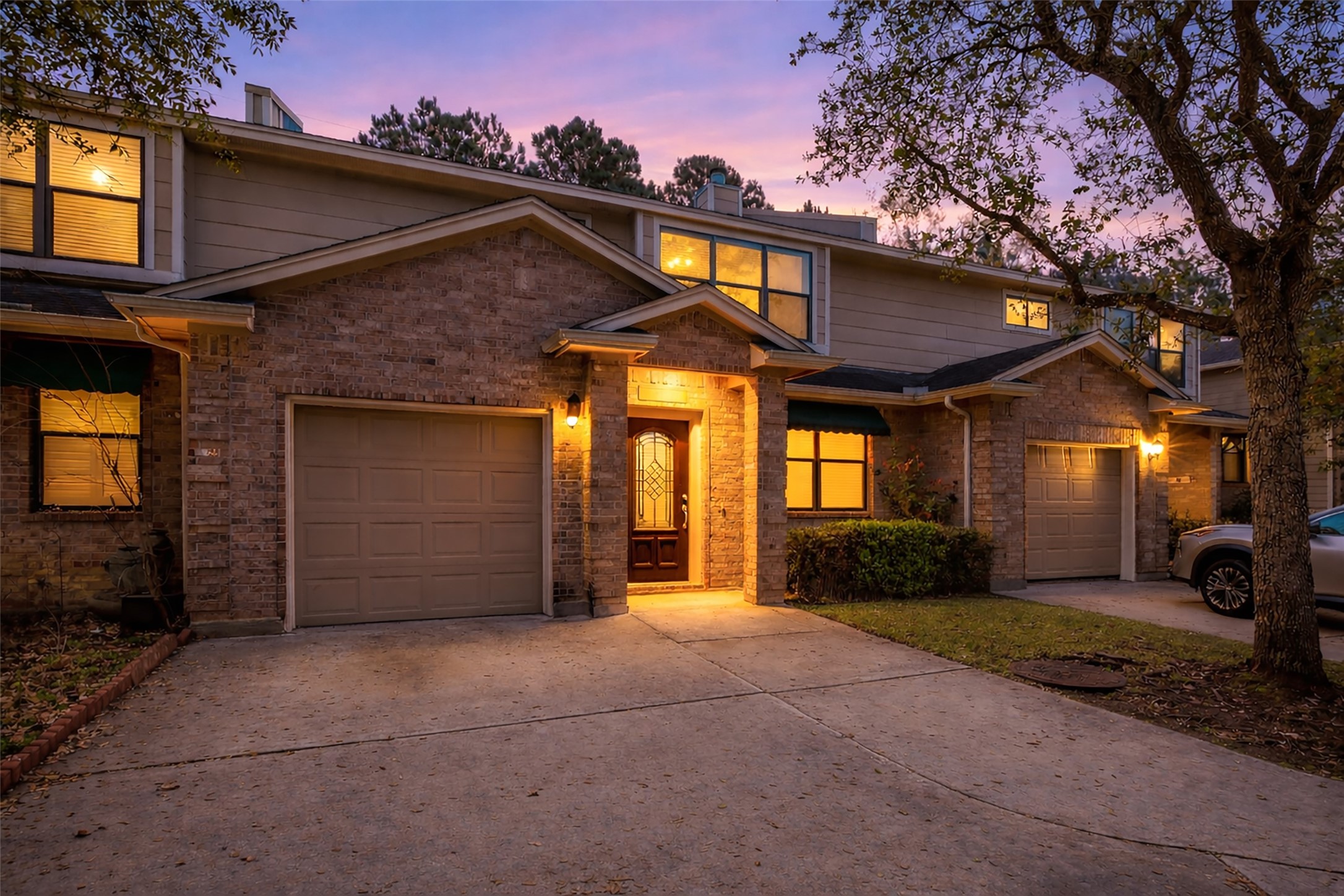 1898 Longmire Road, Unit 5 Conroe, TX 77304 - Photo 6 of 48 a front view of a house with a yard
