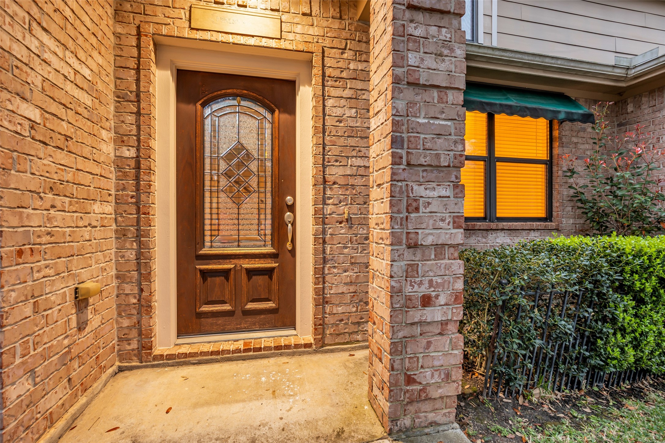 1898 Longmire Road, Unit 5 Conroe, TX 77304 - Photo 7 of 48 a front view of a house with large windows