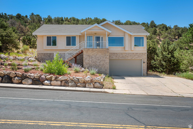 790 East Fiddlers Canyon Road Cedar City, UT 84721 - Photo 1 of 35 Two-story residence featuring a stucco exterior and a brick facade base