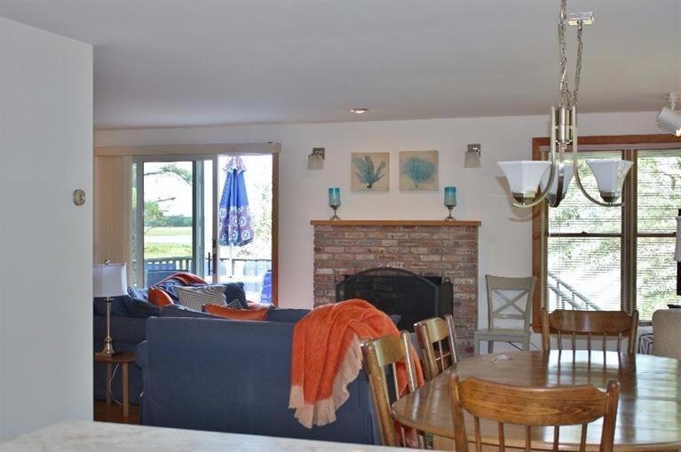 375 Cove Road Wellfleet, MA 02667 - Photo 4 of 25 a living room with furniture and a fireplace