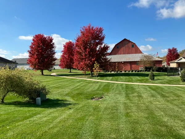 a backyard of a house with lots of green space