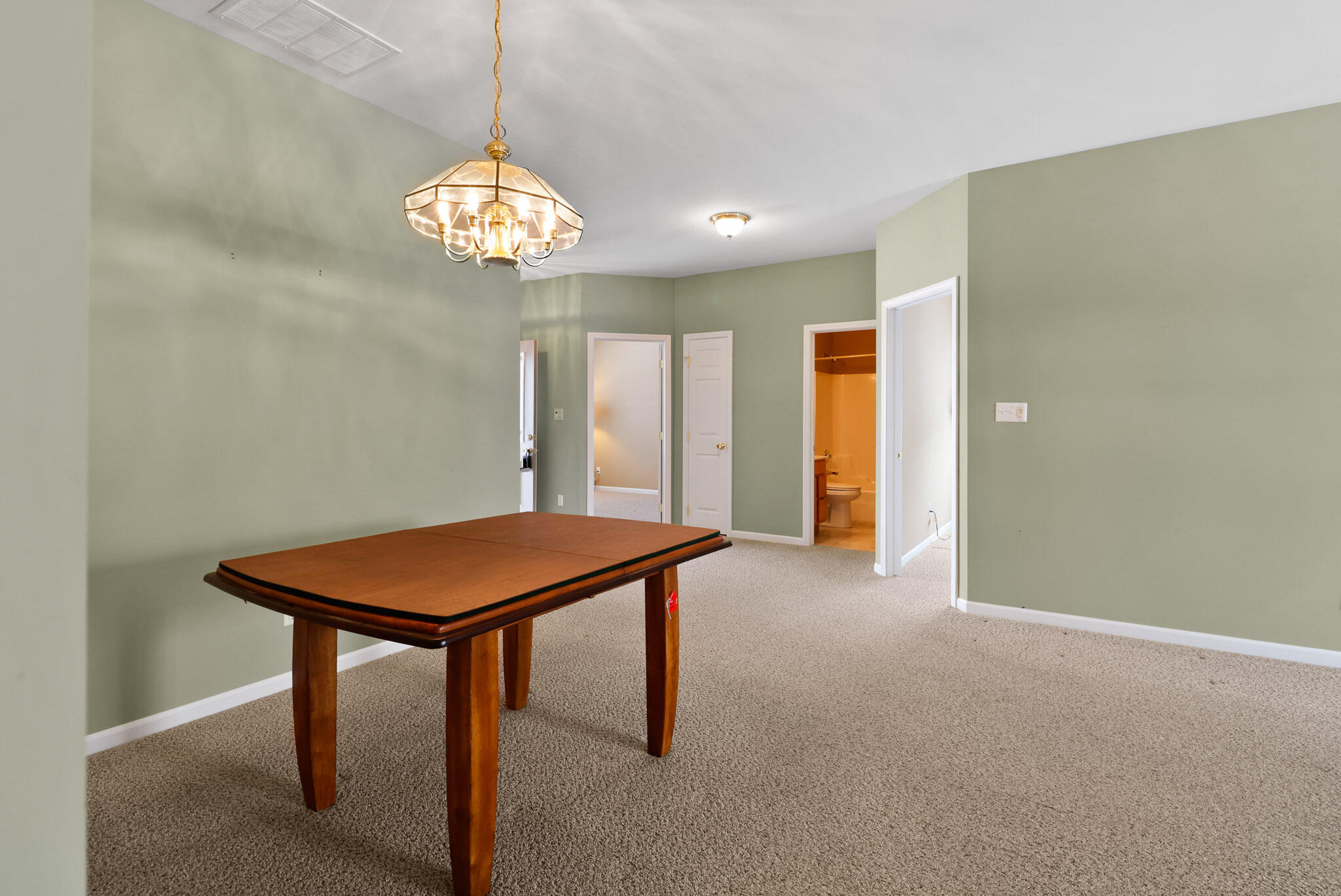 11732 Virginia Court Crown Point, IN 46307 - Photo 7 of 26 a view of a room with a chandelier