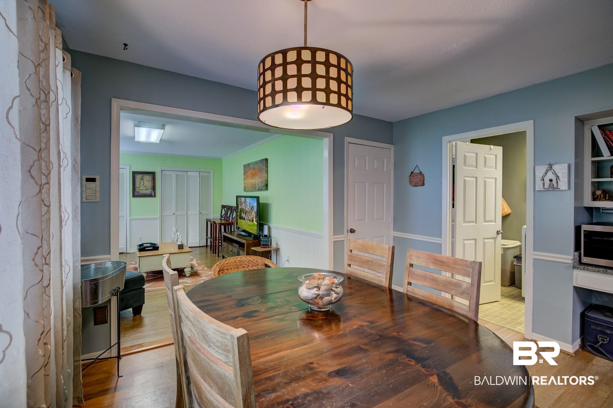 8 Soldiers Route Spanish Fort, AL 36527 - Photo 8 of 42 Dining area featuring wood finished floors and wainscoting