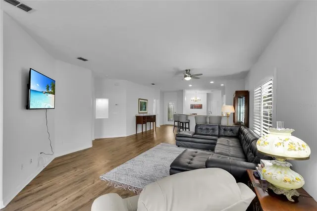 a living room with furniture and a lamp