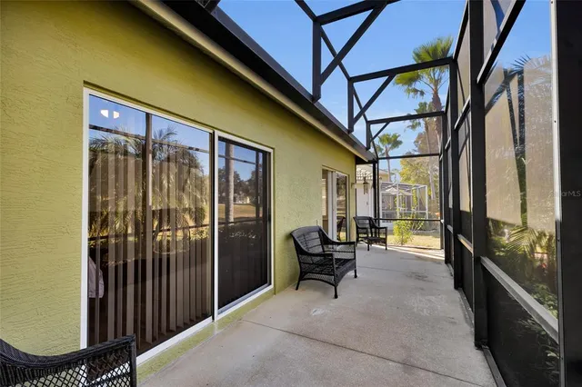 a view of a chairs and table in the balcony