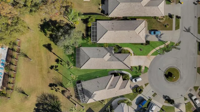 an aerial view of a house with outdoor space