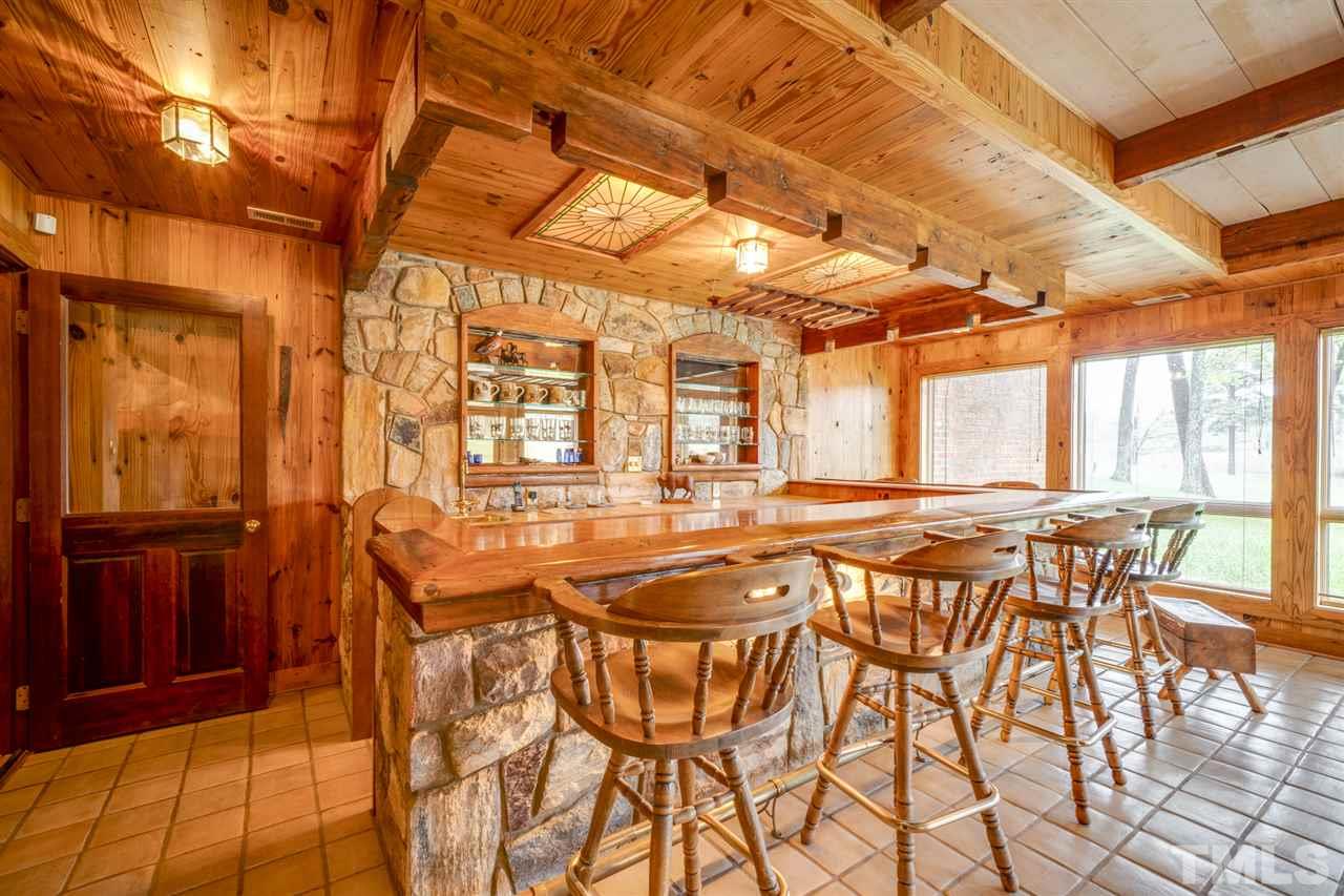 7720 Harps Mill Road Raleigh, NC 27615 - Photo 1 of 28 a view of a dining room with furniture and wooden floor