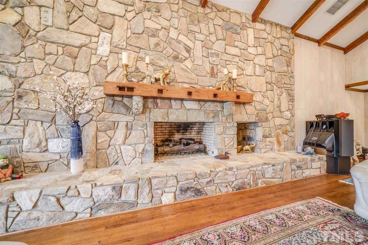 7720 Harps Mill Road Raleigh, NC 27615 - Photo 14 of 28 a living room with fireplace