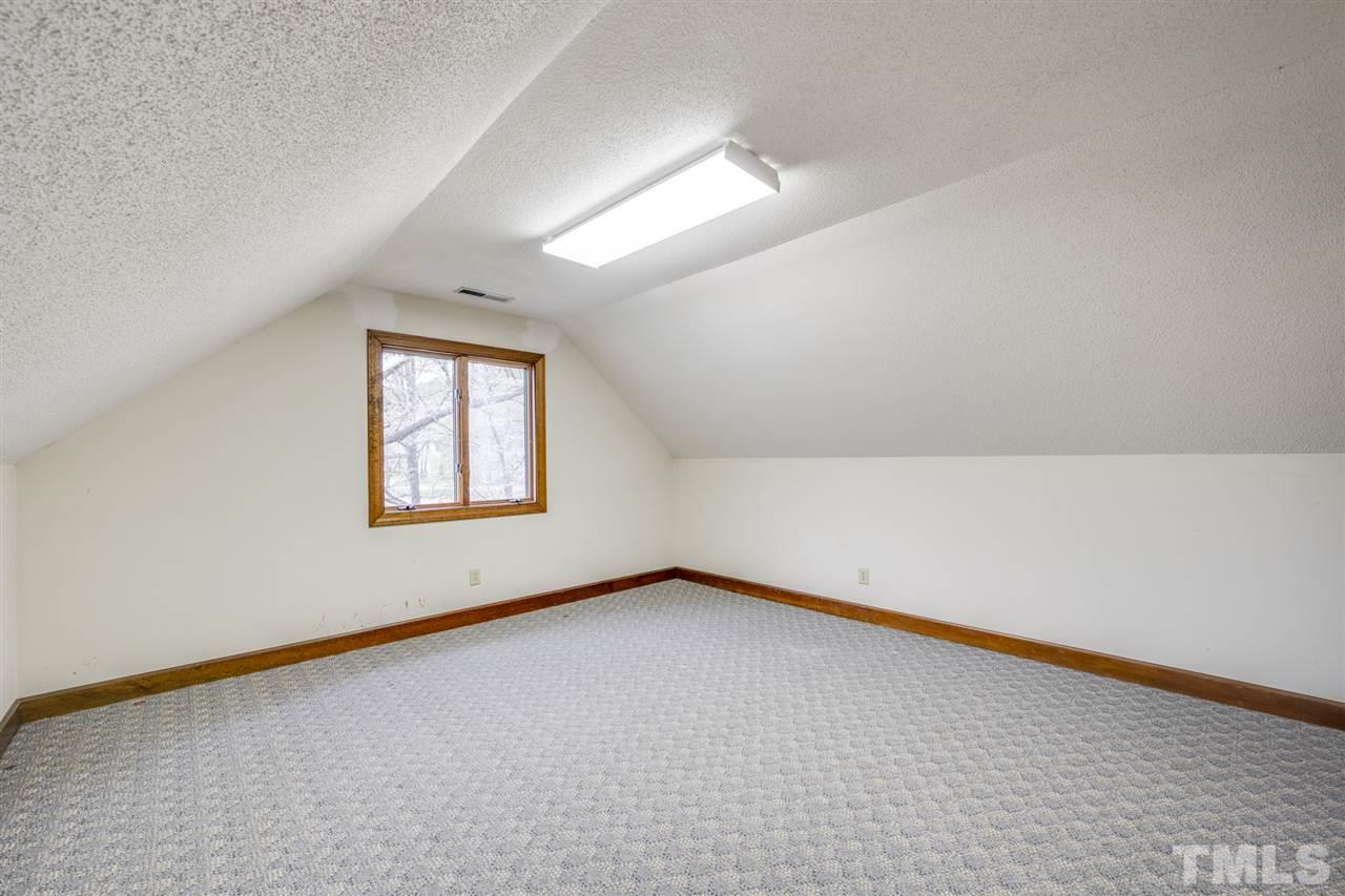 7720 Harps Mill Road Raleigh, NC 27615 - Photo 22 of 28 an empty room with a window