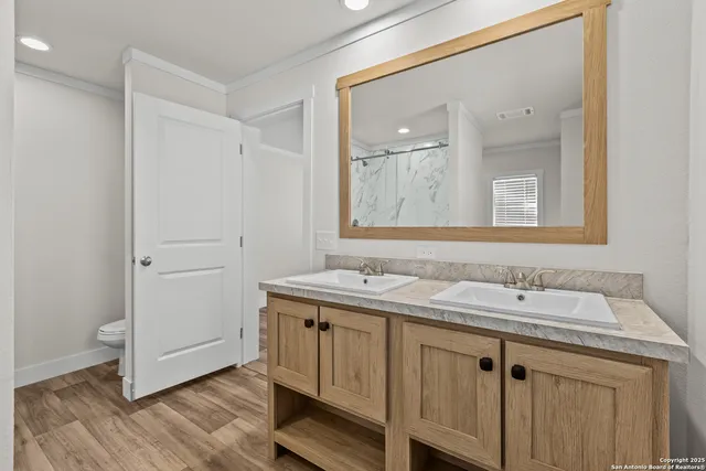a bathroom with a granite countertop sink a mirror and a
